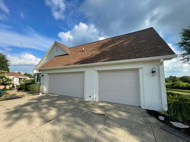 Home exterior with three-car garage