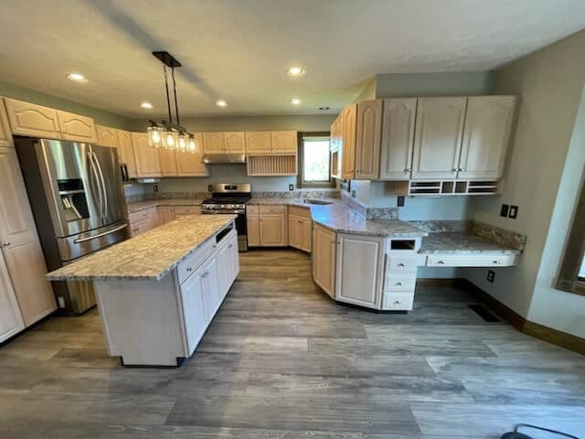 Kitchen island with hardwood flooring