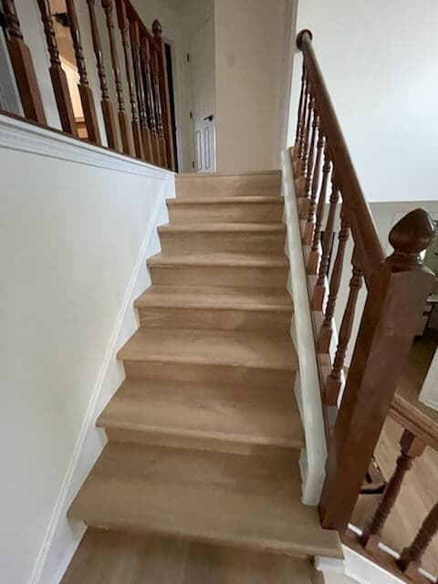 Hardwood staircase with white risers