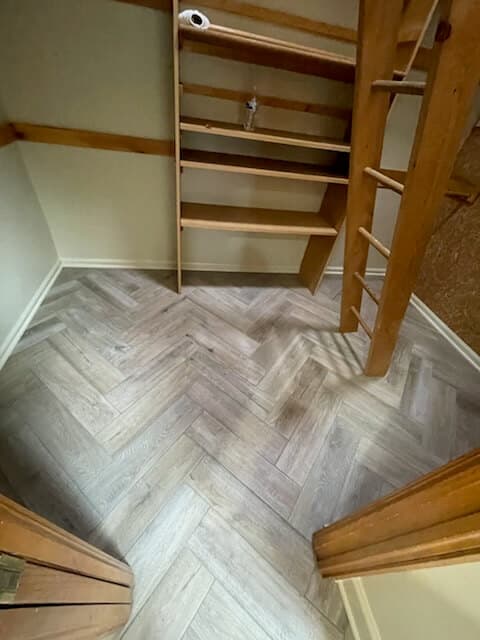 Herringbone tile closet flooring